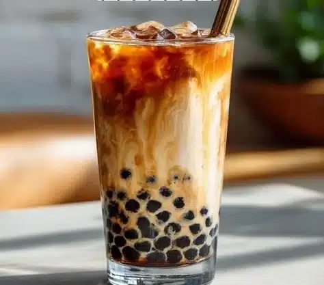 A colorful assortment of boba tea drinks with tapioca pearls and vibrant flavors.