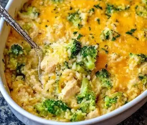 Cheesy Chicken Broccoli Rice Casserole baked in a dish, topped with melted cheese