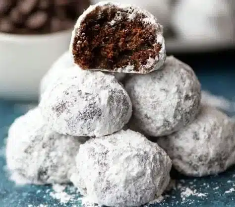 Delicious homemade Chocolate Snowball Cookies dusted with powdered sugar.