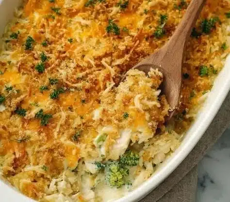 Foolproof chicken rice casserole served in a baking dish with fresh herbs.