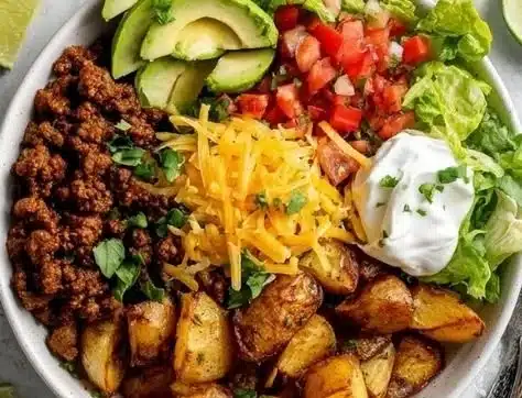 Delicious loaded potato taco bowl with toppings and fresh ingredients