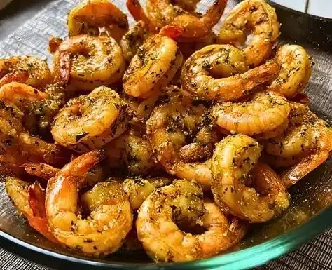 Butter Garlic Shrimp 4 Delicious Butter Garlic Shrimp served with fresh herbs and lemon.