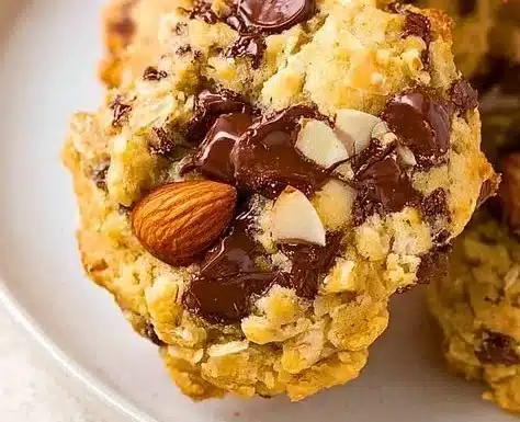 Chocolate coconut cookies with almonds on a plate, ready to enjoy.