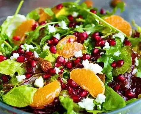 Colorful Christmas Salad with festive ingredients for holiday meals