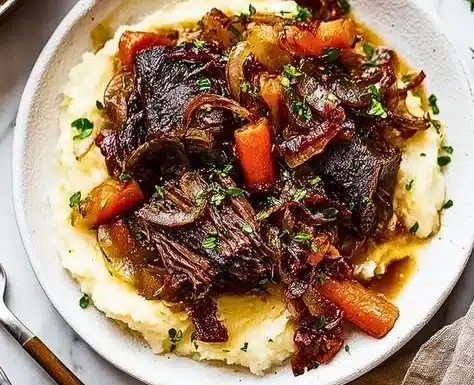 Delicious easy braised short ribs served with garnishes