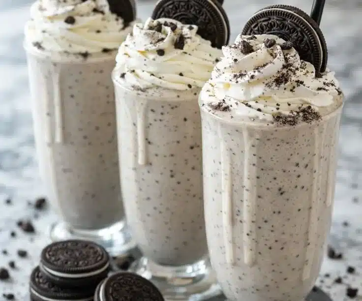 Delicious Oreo milkshake topped with whipped cream and crushed Oreos