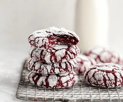 Delicious red velvet crinkle cookies with a rich red color and powdered sugar topping.